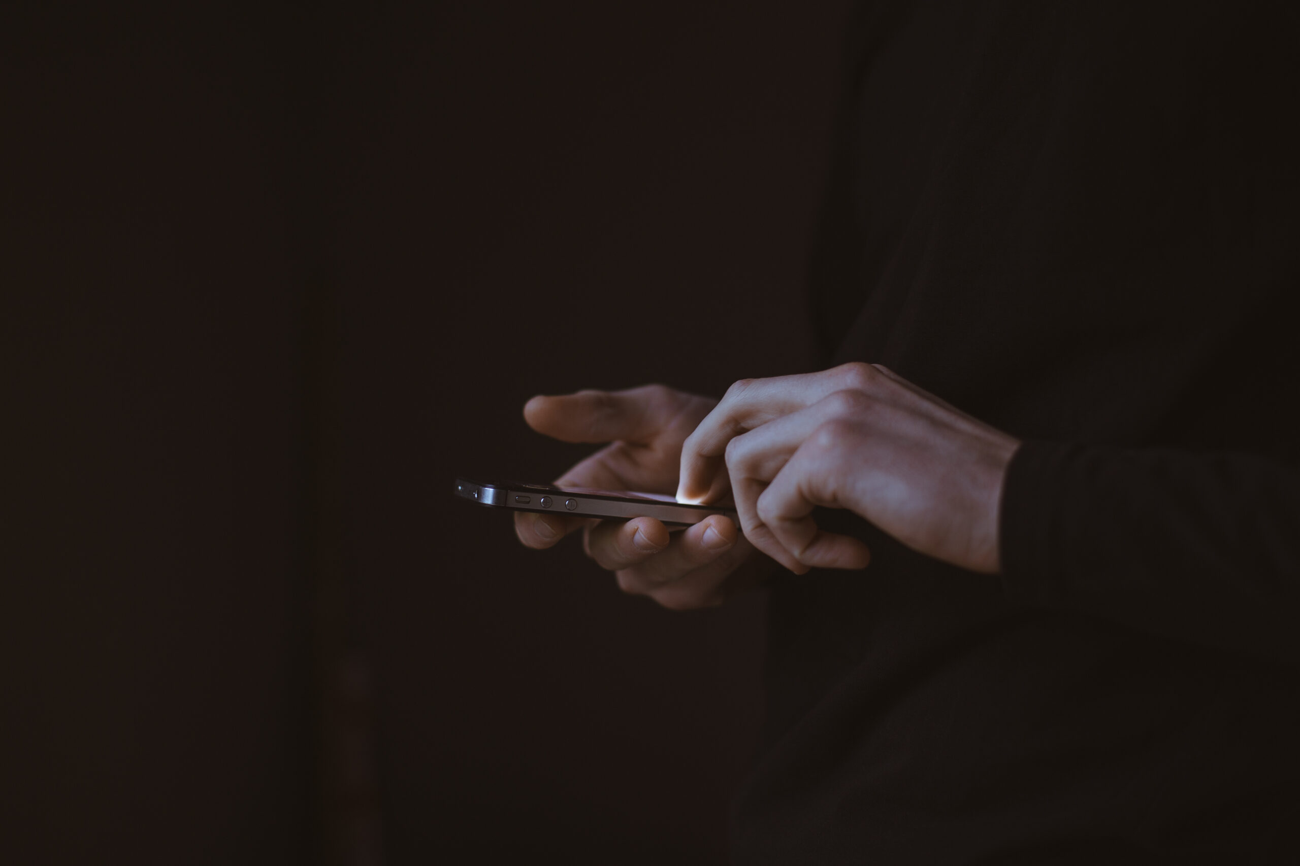 Person checking live location on a smartphone outdoors